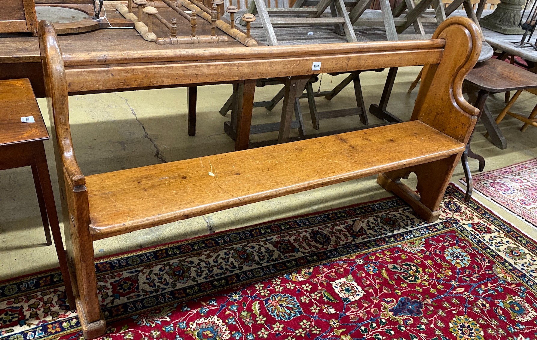 A Victorian pine pew, length 174cm